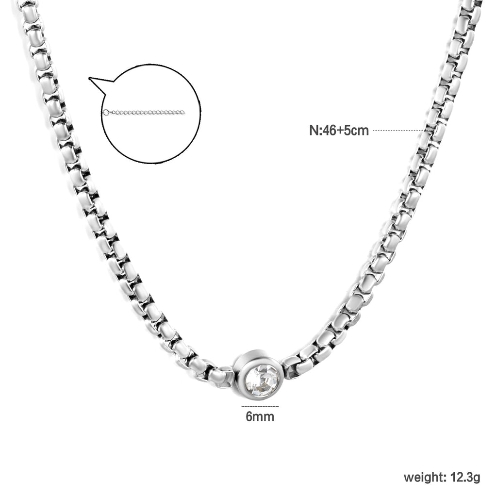 Ketting met ingelegde witte diamant – elegantie van staal en goud