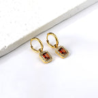 Cirkelvormige hoepeloorbellen met rechthoekige en witte diamanten