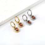 Cirkelvormige hoepeloorbellen met rechthoekige en witte diamanten