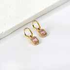 Cirkelvormige hoepeloorbellen met rechthoekige en witte diamanten