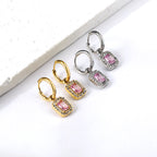 Cirkelvormige hoepeloorbellen met rechthoekige en witte diamanten