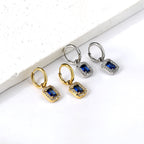 Cirkelvormige hoepeloorbellen met rechthoekige en witte diamanten