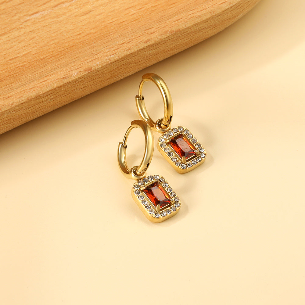 Cirkelvormige hoepeloorbellen met rechthoekige en witte diamanten