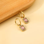 Cirkelvormige hoepeloorbellen met rechthoekige en witte diamanten