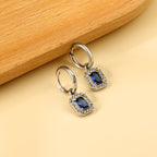 Cirkelvormige hoepeloorbellen met rechthoekige en witte diamanten