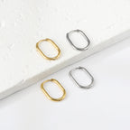 U-vormige minimalistische goudkleurige oorbellen