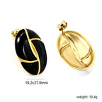 Ovale witte / zwarte druppeloorbellen met versieringen