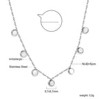 Ketting met zeven witte schelpenhangers