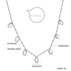 Ketting met zeven witte schelpenhangers