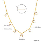 Ketting met zeven witte schelpenhangers