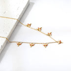 Ensemble de colliers à breloques – Coquillage, cerise, couronne et libellule