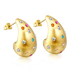 Druppelvormige holle oorbellen met witte diamanten