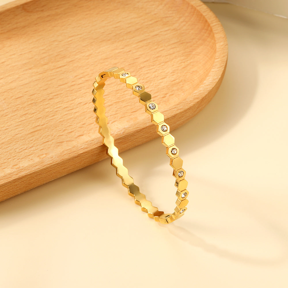 Diamanten en gouden schijfharde armband
