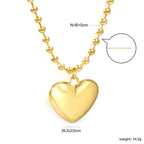 Ketting met holle harthanger en golvende kralenketting