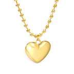 Ketting met holle harthanger en golvende kralenketting