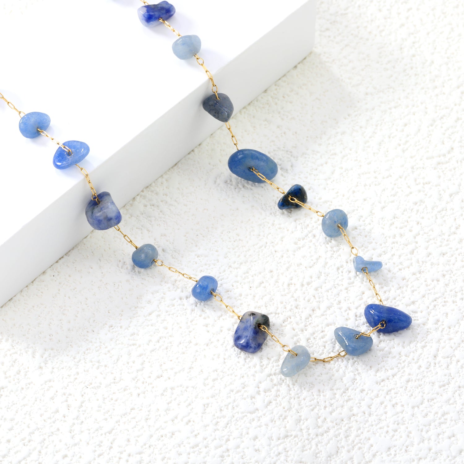 Gouden edelsteen kruisketting