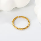 Draaiende gedraaide open ring