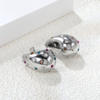 Druppelvormige holle oorbellen met witte diamanten