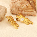 Boucles d'oreilles ailes de papillon avec perle blanche