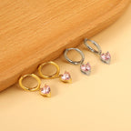 Cirkel met hartvormige diamant roze oorbellen