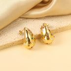 Druppelvormige holle oorbellen met witte diamanten