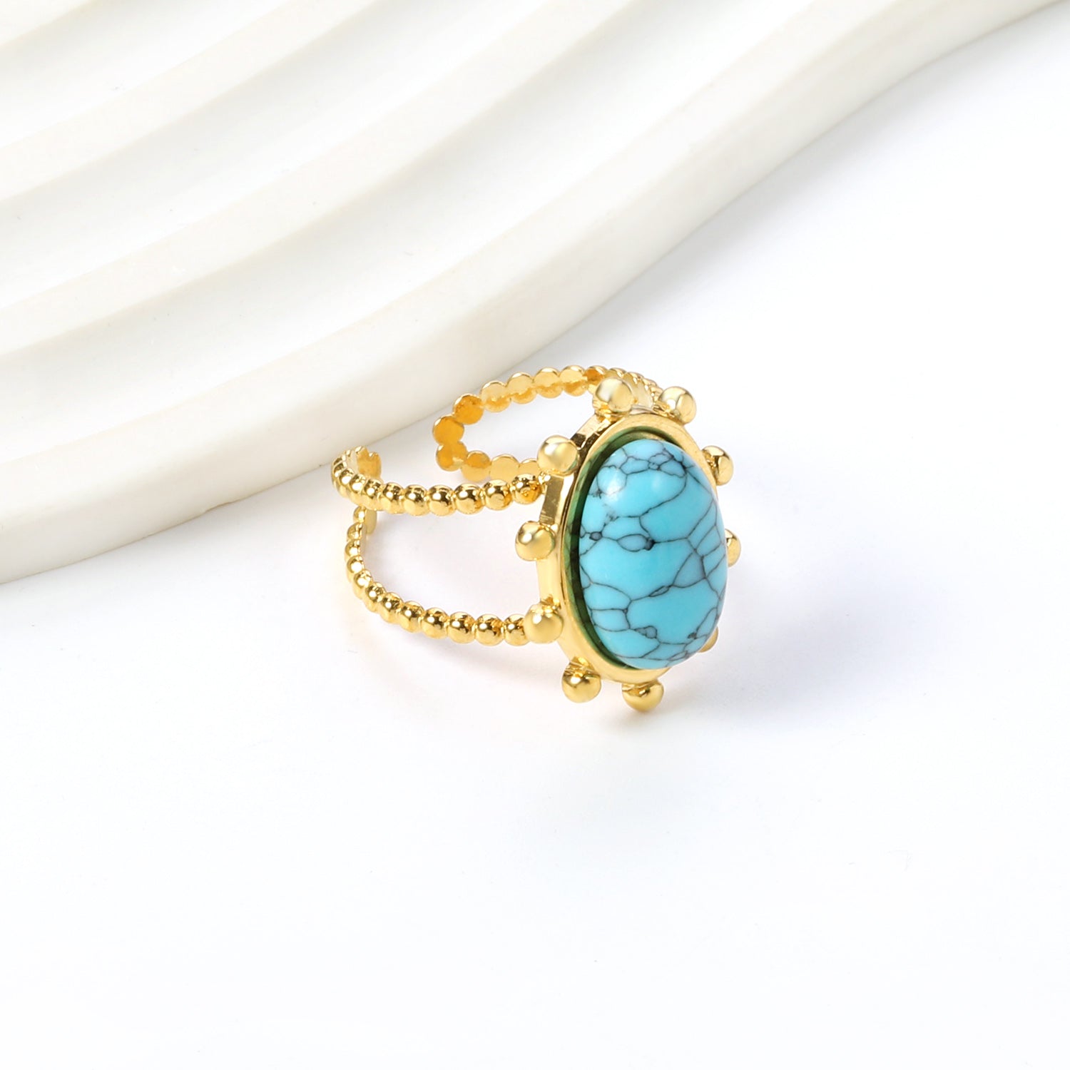 Enkele bandring met heldere, turquoise en anthofyllietstenen