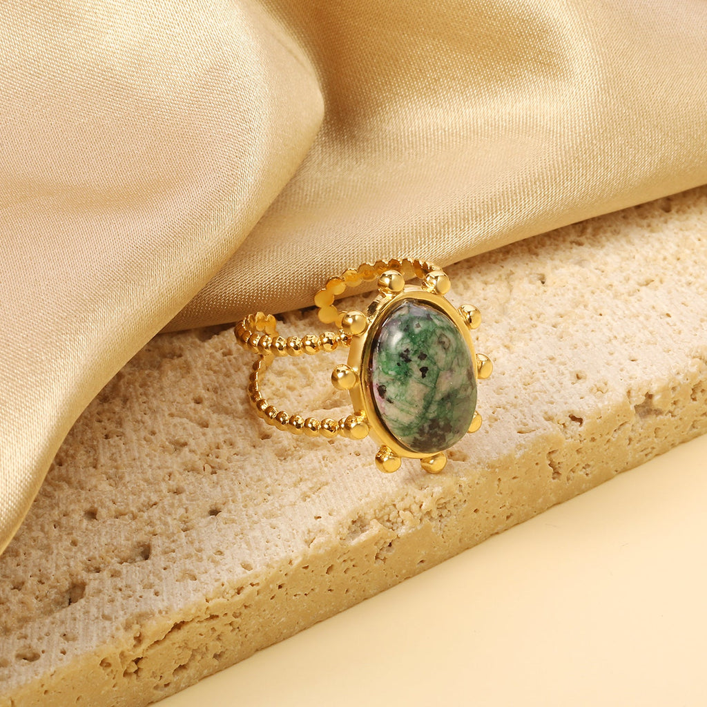 Enkele bandring met heldere, turquoise en anthofyllietstenen