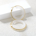 Ronde oorbellen met veelkleurige harslussen