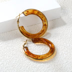 Ronde oorbellen met veelkleurige harslussen