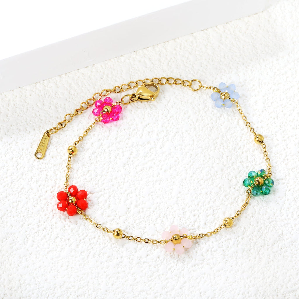 Bracelet en acier et perles de fleurs