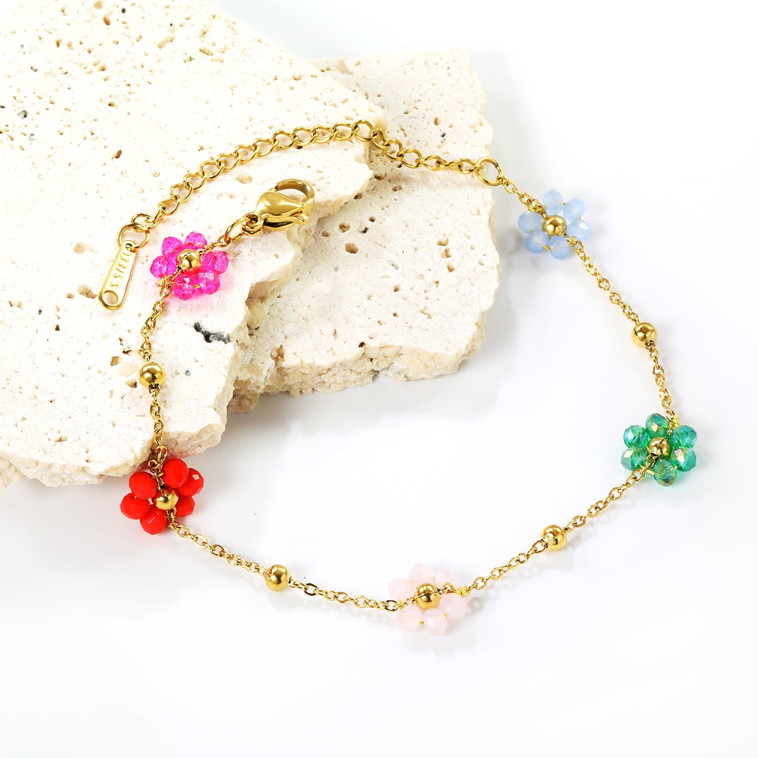 Bracelet en acier et perles de fleurs