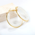 Ronde oorbellen met veelkleurige harslussen