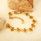 Brede vergulde armband met ketting