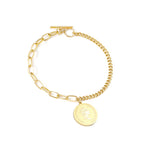 Dikke armband met gouden hartbedel 