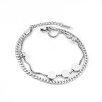 Dikke armband met gouden hartbedel 