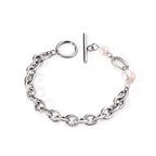 Dikke armband met gouden hartbedel 