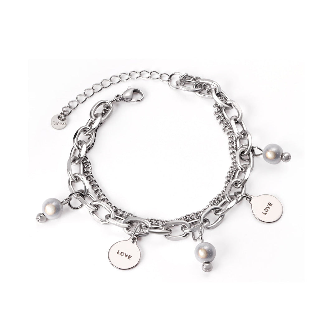 Dikke armband met gouden hartbedel 