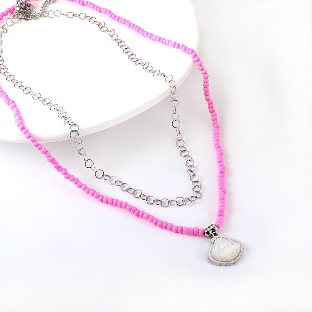 Dubbele ketting met schelpen en roze kralen