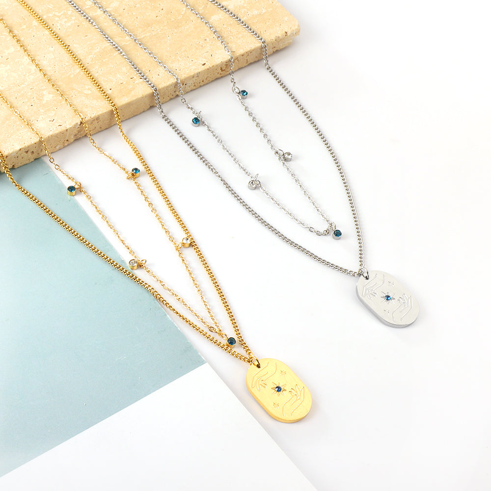 Ovale handen dubbele ketting met blauwe en gemengde kleuren diamanten