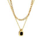Gold-tone stainless steel double chain necklace featuring a rectangular green diamond pendant from JCS Jewelry – durable, waterproof, and hypoallergenic.