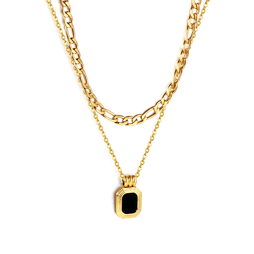 Gold-tone stainless steel double chain necklace featuring a rectangular green diamond pendant from JCS Jewelry – durable, waterproof, and hypoallergenic.