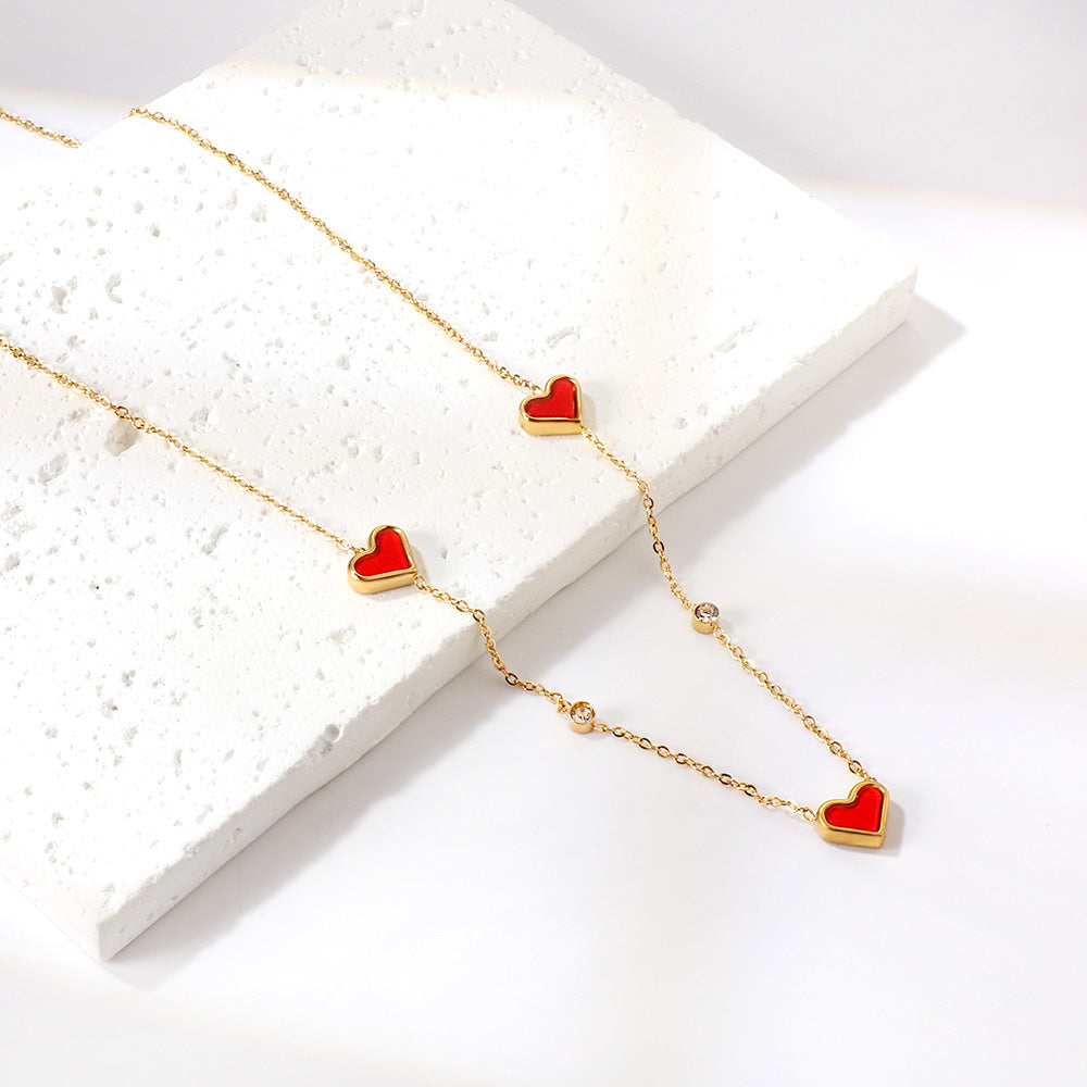 Drievoudige hartschelp en diamanten hanger ketting