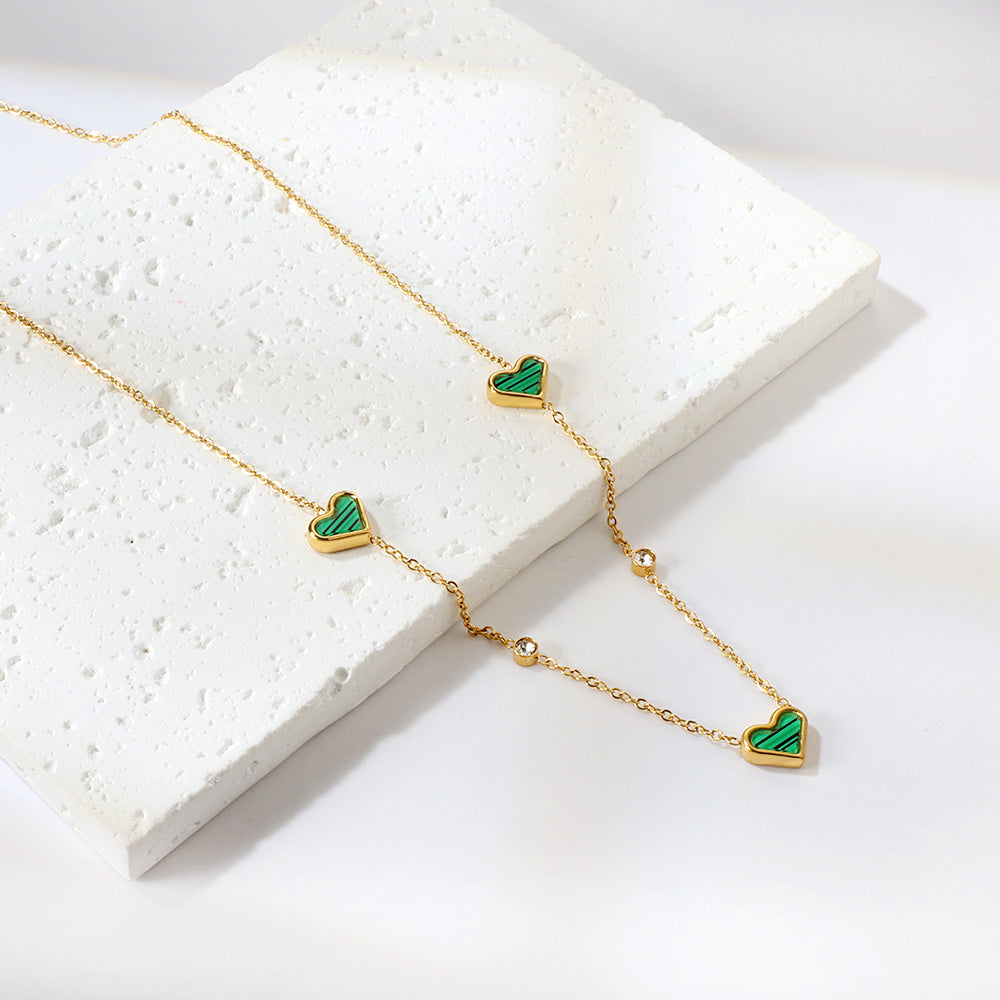 Drievoudige hartschelp en diamanten hanger ketting