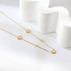 Collier avec pendentif triple cœur coquillage et diamant