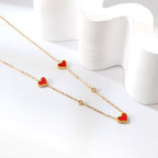 Collier avec pendentif triple cœur coquillage et diamant