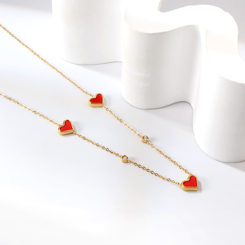 Drievoudige hartschelp en diamanten hanger ketting