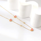 Collier avec pendentif triple cœur coquillage et diamant