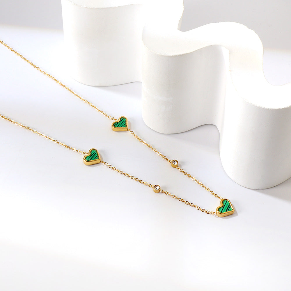 Drievoudige hartschelp en diamanten hanger ketting