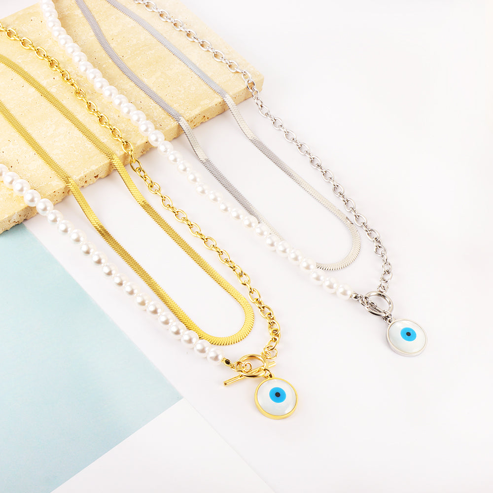 Blauwe oog- en halve parel dubbele ketting