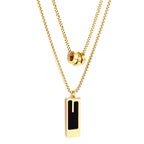 Gold-tone stainless steel double chain necklace featuring three round hollow pendants and a rectangular black enamel drop — by JCS Jewelry.